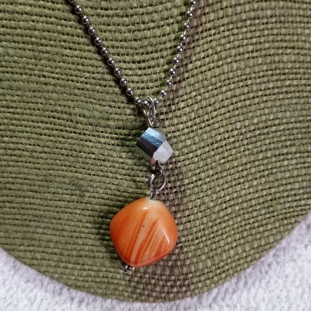 Silvertone Ball chain with faceted silvertone bead orange bead